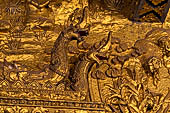 Luang Prabang, Laos - Wat Mai, the gilded stucco engravings of the veranda. 